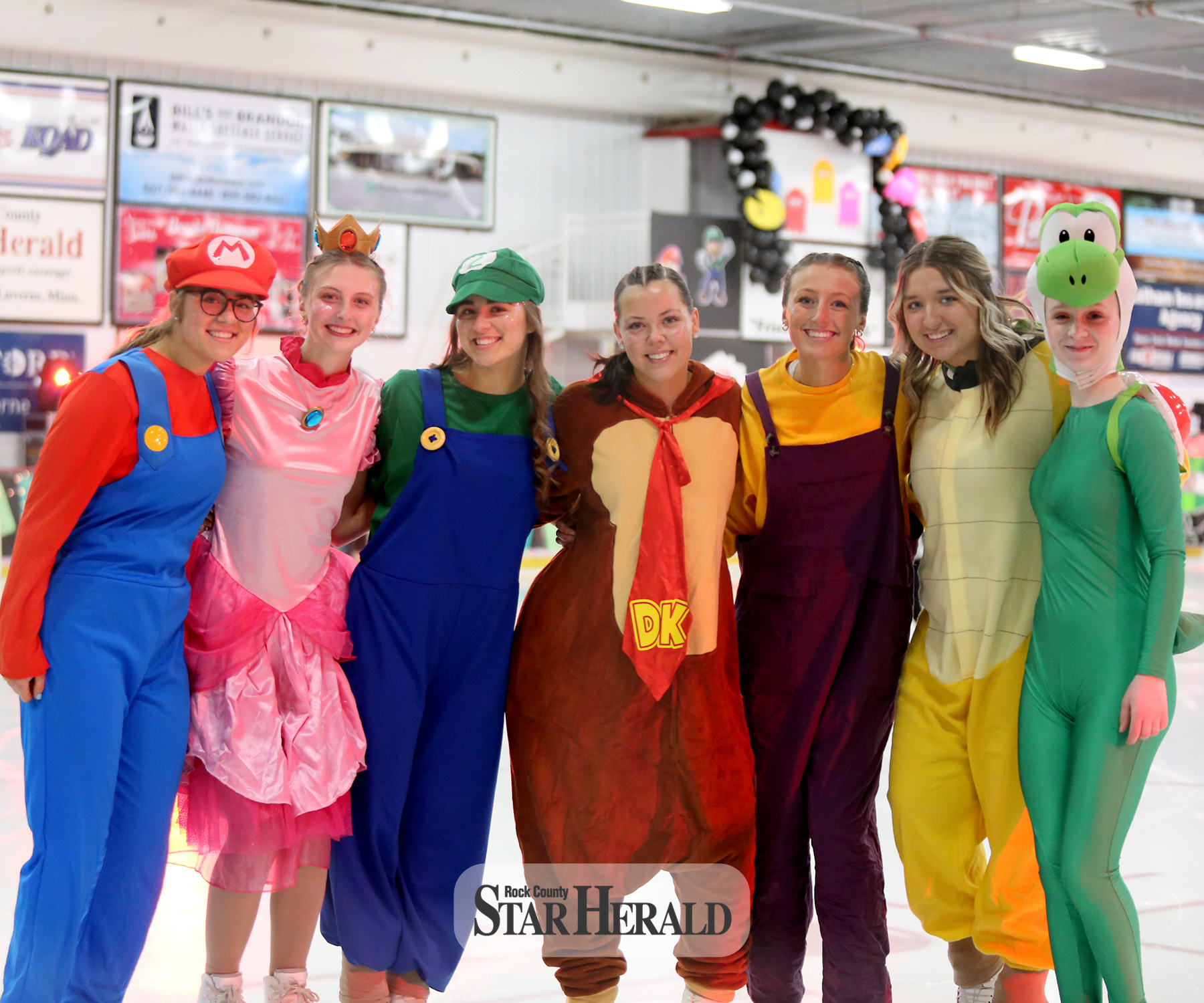(From left) Grace Schneekloth, Marisa Thier, Emma Schneekloth, Mya Akin, Augusta Papik, Madilyn Wenzel and Josalyn Hiebert prepare to take the ice Friday, March 22, for their performance at this year’s Ice Show. See www.star-herald.com for more photos.