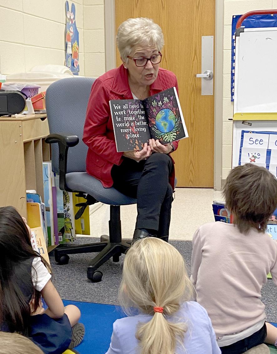 Shirley Harrison reads her children’s book, “We all Need,” to Jill Wagner’s elementary school classroom in December. She hopes to read to other classrooms this spring. Submitted Photo