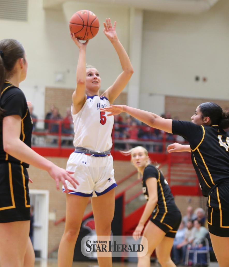 H-BC senior Lanae Elbers uses her height to go above the Eagles for a basket in the section quarterfinal game Friday, March 1, in Worthington.