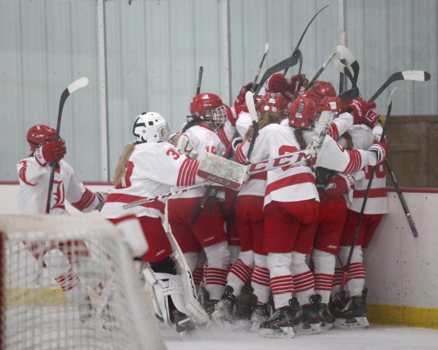 The Luverne girls’ hockey team rushed freshman Tenley Behr after her game-winning goal in overtime. The Cardinals beat Mankato East 4-3 at home Saturday, Dec. 9, after coming back from a 3-0 deficit.