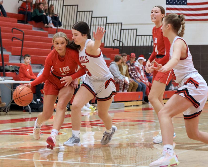 LHS senior Kayla Bloemendaal tries to turn the corner against a Redwood Valley defender Friday, Dec. 15, at home. Luverne fell to Redwood 59-26 in the game.