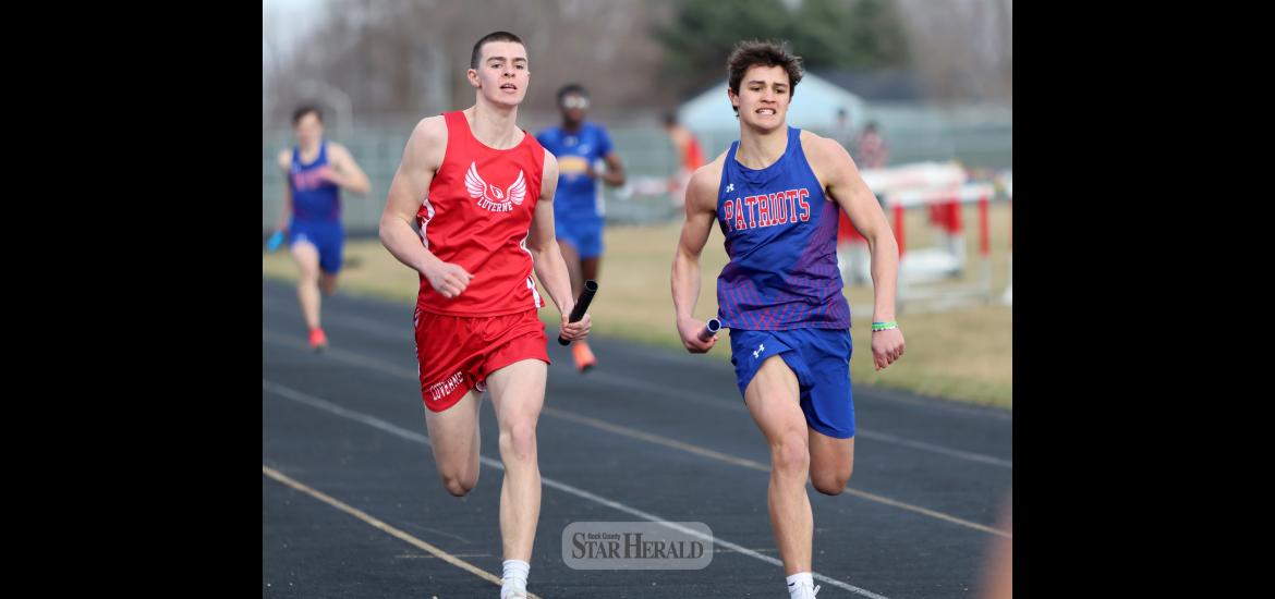 LHS junior Coulter Thone (left) and H-BC sophomore Micah Bush push toward the finish line Friday, April 5, in Luverne. Bush and his 4-by-200-meter relay teammates finished in second with a time of 1:39.17. The LHS team was disqualified in the race.