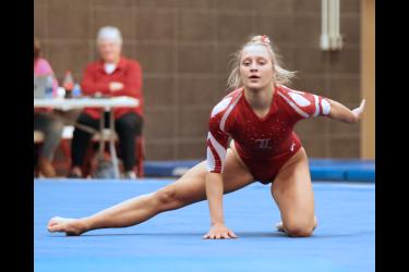 Junior Ella Reisdorfer finishes her floor routine Friday, Jan. 26, in Luverne. Reisdorfer took first place in the event with a new school record of 9.3750. The Cardinals beat the Marshall Tigers 134.950 to 118.7250 in team competition.