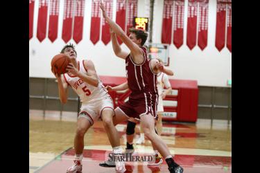 LHS junior Carter Sehr looks for an opening against Fairmont under the basket. Fifth-seed Luverne upset fourth-seed Fairmont 65-57 in Fairmont Saturday, March 2. 