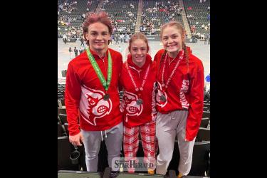 LHS wrestlers senior Sam Rock (left), sophomore Bernie Rock and freshman CeCe Rock competed in the 2024 State Individual Wrestling Tournament March 1-2 in the Xcel Energy Center. Sam placed fifth, Bernie and CeCe both took second place.