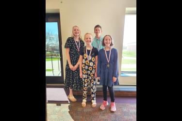 Four students from Hills-Beaver Creek earned medals Sunday at the 20th annual Creative Writing Contest awards ceremony. Pictured are (from left) Penni Moore, Londyn DeBoer, Bryce Metzger and Grace Prohl. Submitted Photo