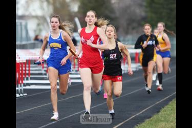 Cardinals senior Cassi Chesley runs the first leg of the 4-by-800-meter relay in Luverne Tuesday, April 9. Chesley and her Luverne teammates finished in third place with a time of 10:55.71. 