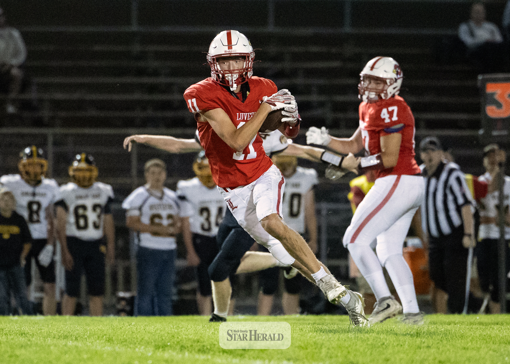 Greg Hoogeveen photo/0917LHSFB1 Cardinals junior Jaxon Pick, No. 11, looks for defenders after making a catch in the middle of the field. Pick took the ball to the house. Luverne beat Sibley East 55-6 at home.