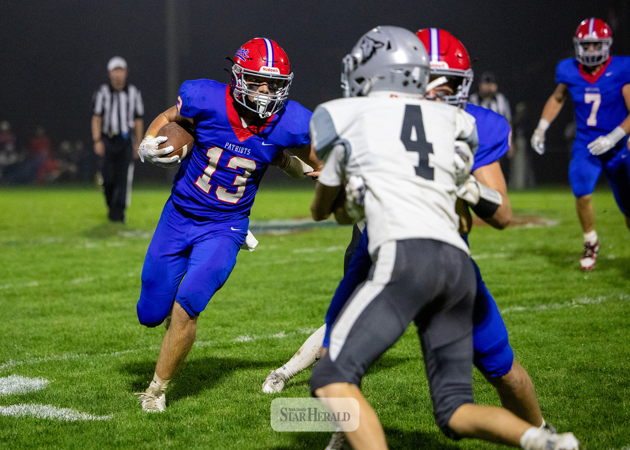 Greg Hoogeveen photo/0924HBCFB1 Patriots junior Max Sammons follows a block by his teammate against Heron Lake-Okabena-Fulda Friday, Sept. 18, in Hills. H-BC won the contest 22-0. 