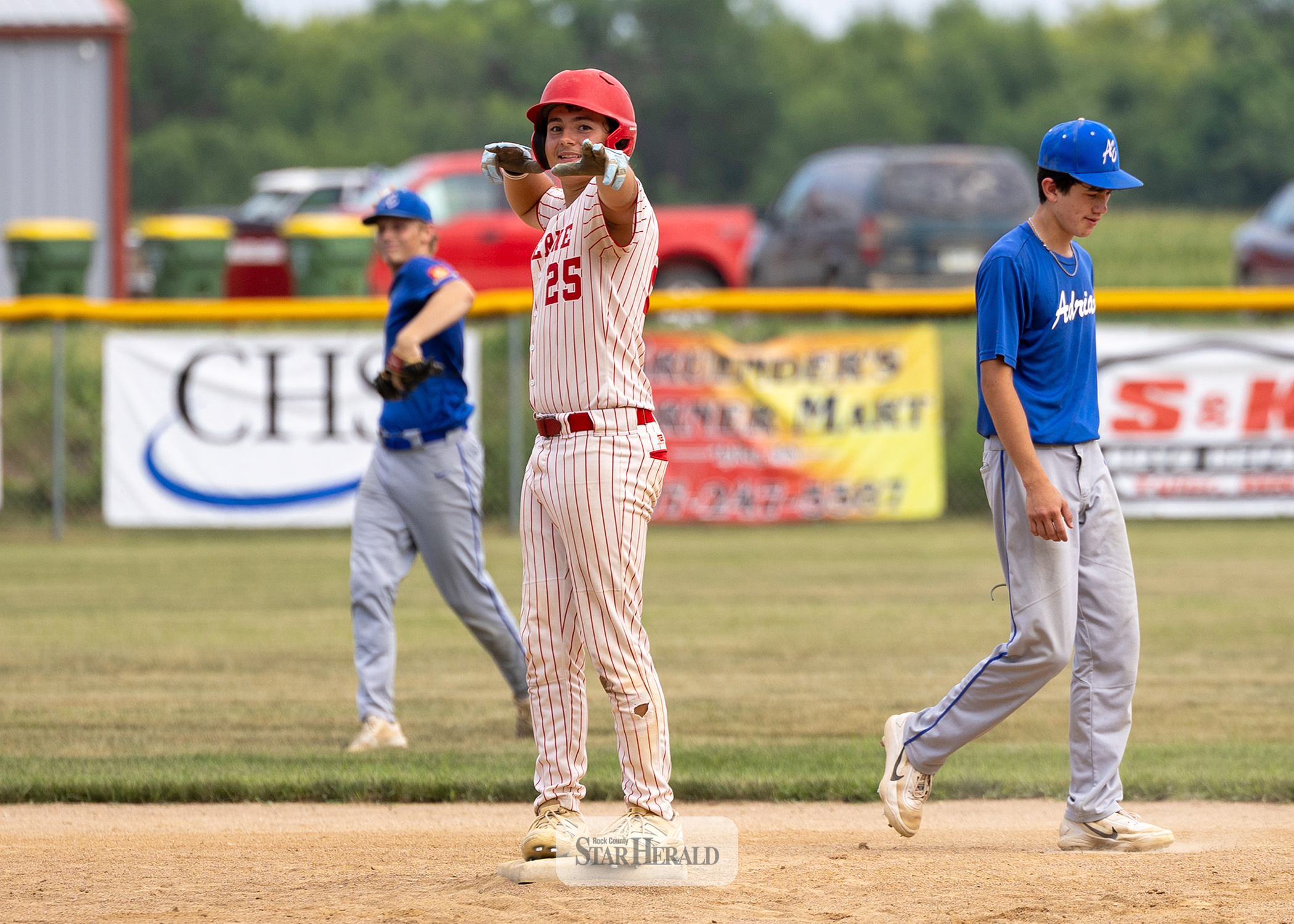 Greg Hoogeveen photo Luverne Junion Legion player Korbin Miles celebrates on second base after a double against Adrian Monday, July 20, in Ruthton. Luverne beat Adrian 6-1 to stay alive in the sub-state tournament elimination bracket.
