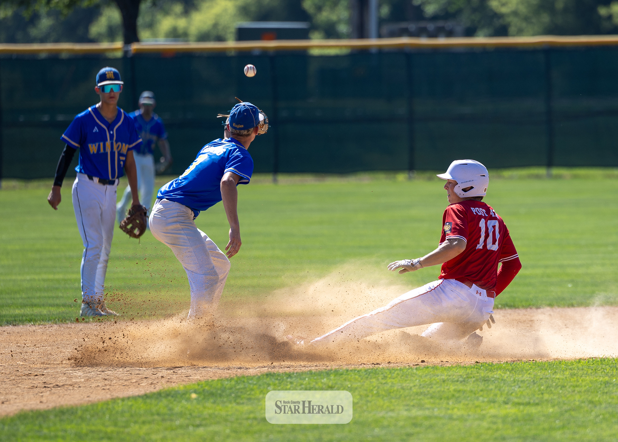 Blake Sauer safely slides into second base against Windom July 11 at home in sub-sub state game action. Windom beat Luverne 6-4 with both teams advancing to sub-state tourney.