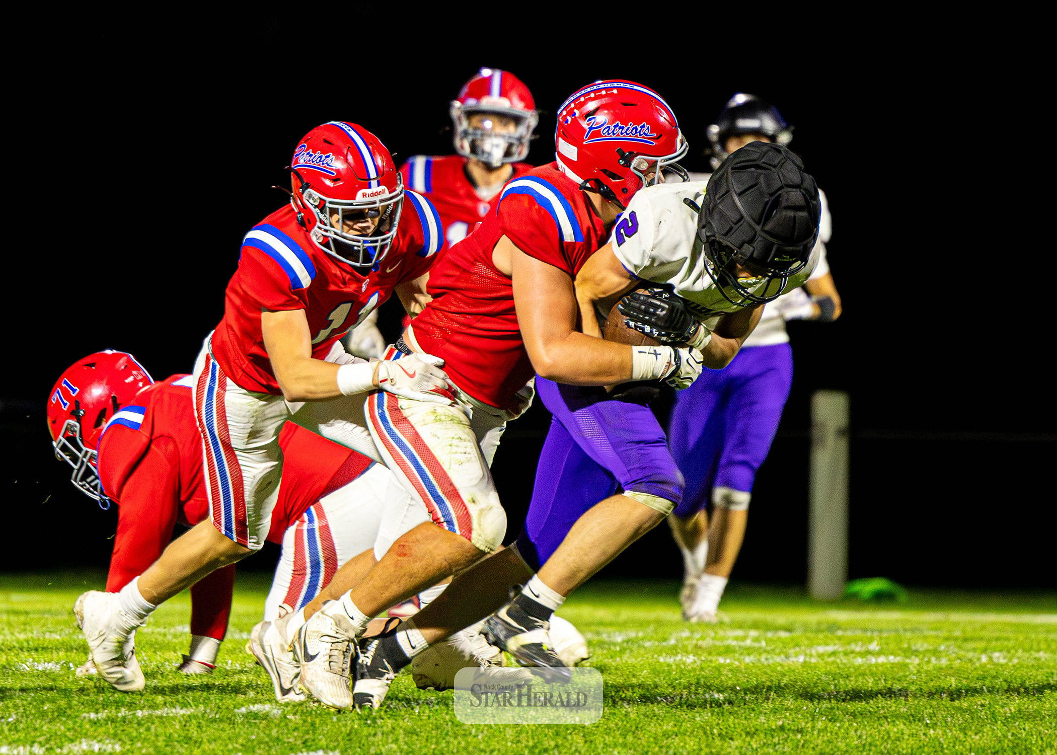 Samantha McGaffee photo/1008HBFB1 H-BC junior Karson Metzger wraps up a Mustangs player with the ball Friday, Oct. 2, on the road. THe Patriots beat GHECT 58-0 in the game.