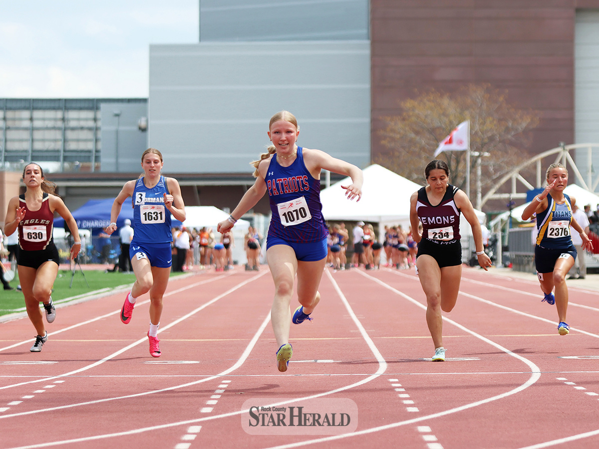 Rock County SH-BC freshman Brynn Bakken, center No. 1070, finishes her prelim 100-meter race in first place with a time of 12.30 on Friday, May 3, at the 99th Annual Howard Wood Dakota Relays in Sioux Falls. Bakken took first place in the finals on Saturday, May 4, with a time of 11.98.tar Herald Photo