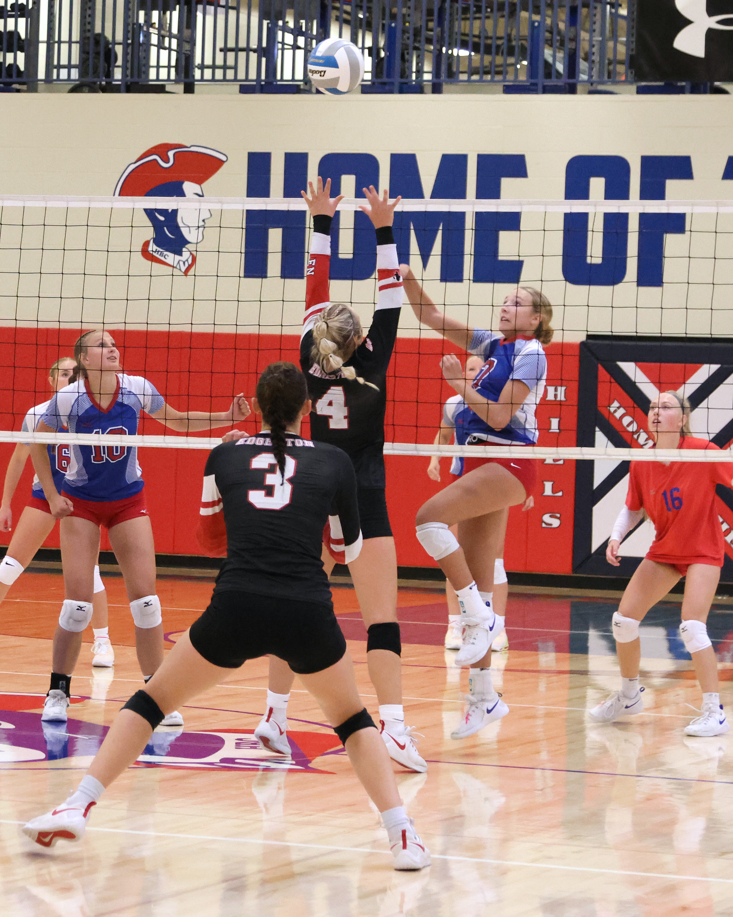 Sophomore Ella Sammons jumps for a ball on the Patriots’ side of the net against Edgerton Tuesday, Sept. 5, at home. The Patriots lost three close games to the Flying Dutchmen.