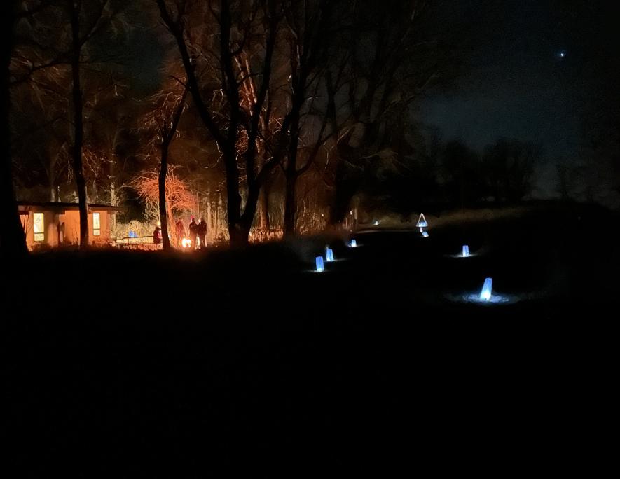 The warming house, bonfire and luminaries glow in the dark under a starry sky at the Blue Mounds State Park Saturday night. Lori Sorenson/Rock County Star Herald Photo