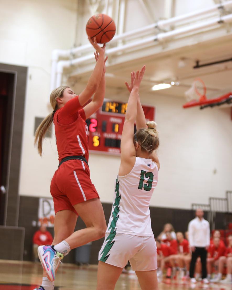 Senior Tori Serie shoots over a Pipestone player Tuesday, Jan. 23, in Luverne. The Cardinals beat the Arrows 69-33 in the game.