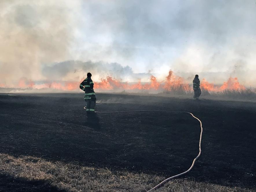 Luverne volunteer firefighters monitor a ditch fire that got out of control Wednesday, Jan. 29, along 151st Street in Mound Township. Photo courtesy of Luverne Fire Department