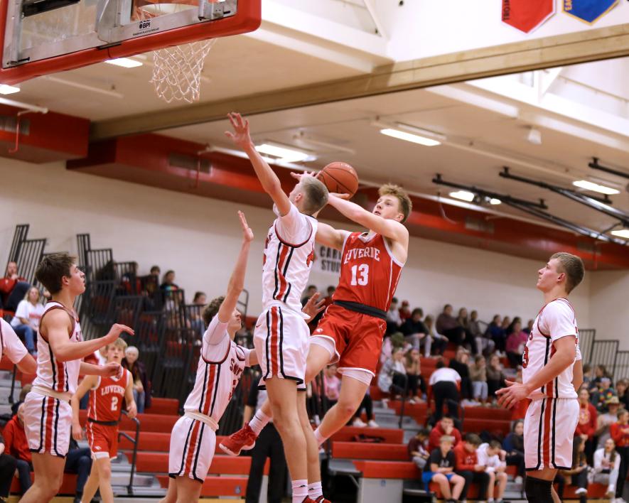 Jaydon Johnson takes to the air against a St. James opponent for a basket Thursday, Feb. 8, in Luverne. The Cardinals won the game 80-45 over the Saints.