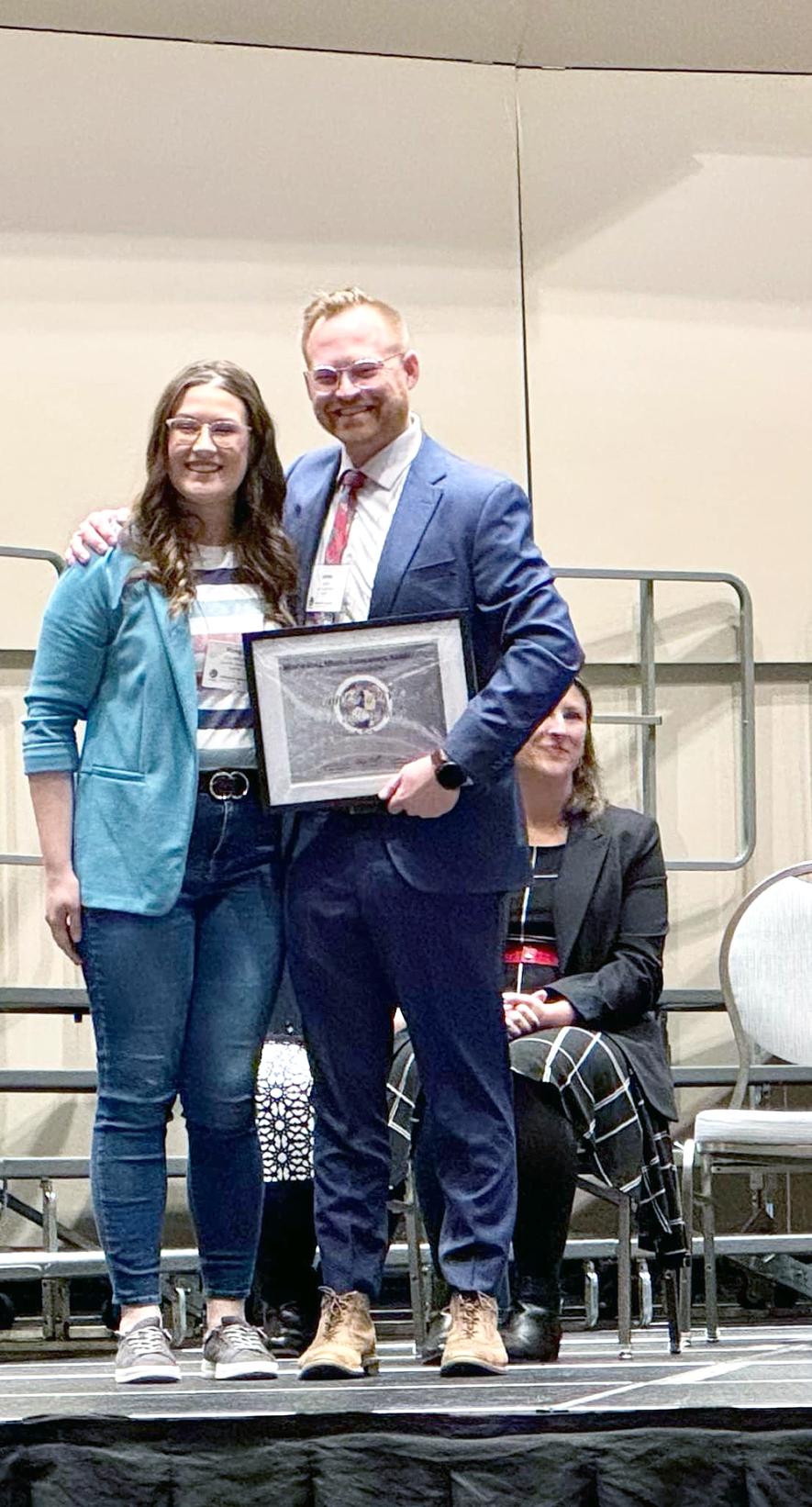 James Jarvie, Luverne High School instrumental instructor (right), poses with Morgan Van Holland, Luverne Elementary music instructor at the Minnesota Music Educators Association Mid-Winter Conference earlier this month in Minneapolis. Jarvie received a “Wall of Fame” certificate for his work in music education. Van Holland nominated Jarvie for the award. Submitted Photo