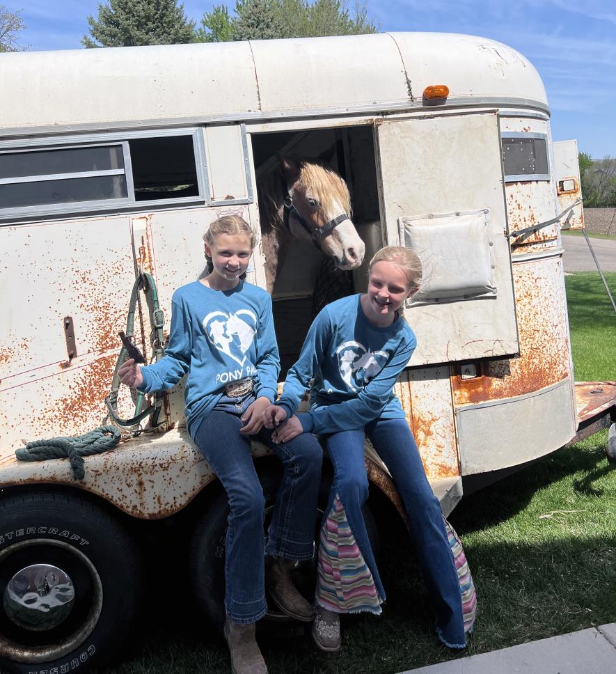 “Pony Pals” was developed by Kinley Dwire (left) and Afton Nuffer. The girls’ business centered around selling an experience of feeding treats to a horse and/or pony and learning about equines. Submitted Photo