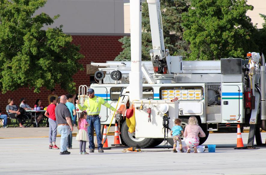 Landon Hazelton of Sioux Valley Energy greets visitors and answers questions about the Sioux Valley Energy utility truck. Lori Sorenson/Rock County Star Herald Photo