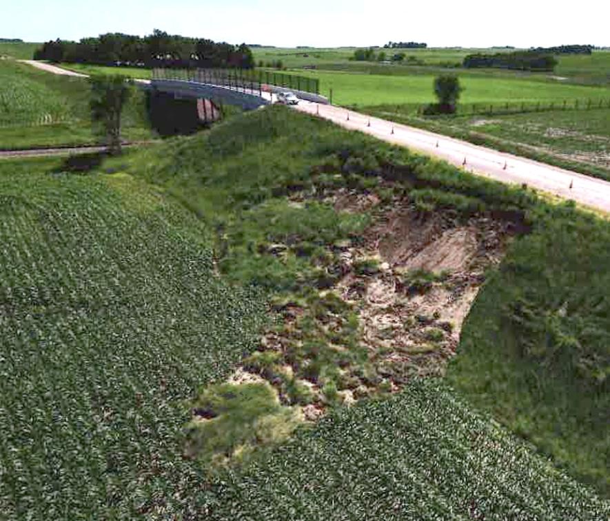 Soil on the northern bridge support on County Road 52 was washed out during the June 21-22 flood event, and the site is currently being evaluated for repairs. Photo courtesy of the Rock County Highway Department