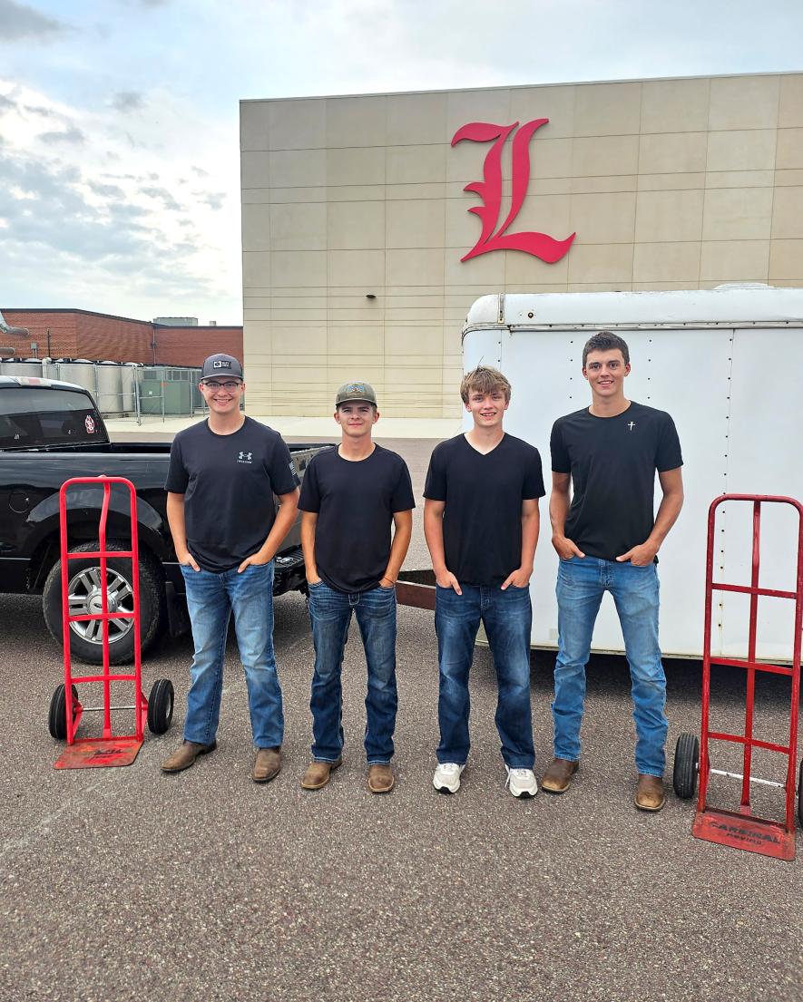 Cardinal Moving owners Adam Ask (from left) and Marcus Vortherms have sold their business to Asher Barron and Coy Thone. The new owners are incoming juniors at Luverne High School. Jason Berghorst/Rock County Star Herald Photo