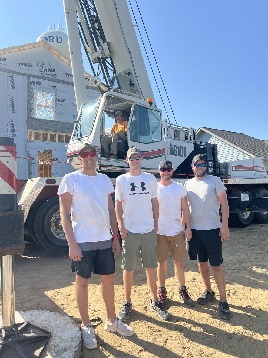 Five Luverne High School graduates (from left) Dalton Jacobsma, Joe Guy, Matthew Sterrett, Jake Guy and Brian Barnhart (in crane) came together last week to set the framing and trusses for a home being built for Angela and TJ Newgard (a Luverne teacher). Submitted Photo