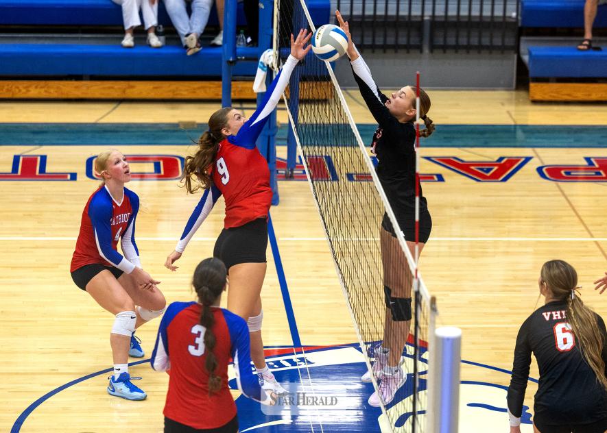 Greg Hoogeveen photo/0917HBCVB1 Patriots senior Ava Steinhoff, No. 9, fights for a free ball over the net against Viborg-Hurley Sept. 10 at home. The Patriots beat the Cougars in three straight sets in their first home match.