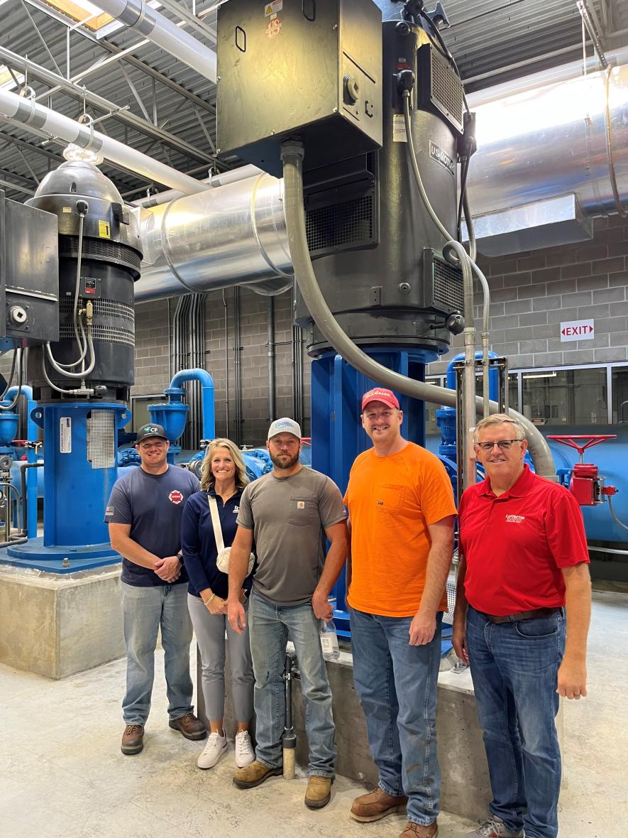 From left are City Administrator Jill Wolf, water operator Aaron Altman, Mayor Pat Baustian (who serves on Lewis & Clark’s Board of Directors) and water operators Aric Uithoven and Joe Ahrens.