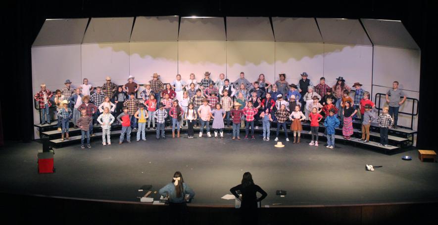 Third-graders sing “Go for the Gold!” Mavis Fodness/Rock County Star Herald Photo