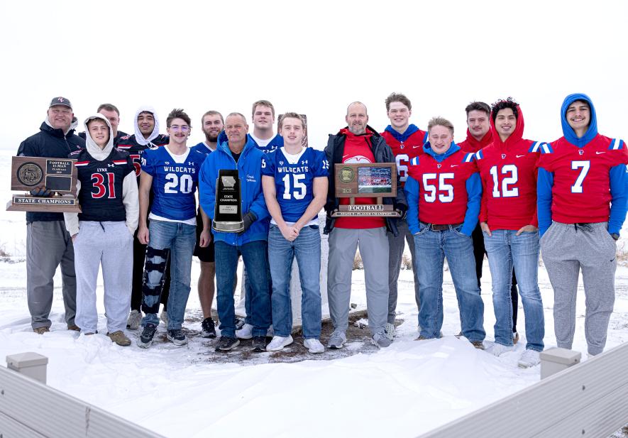 Coaches and players from Minnesota, Iowa and South Dakota state champion football teams met at the tri-state marker Dec. 4 to congratulate each other on their winning seasons. Pictured are (from left) Brandon Valley coach Matt Christensen and players Hudson Parliament, Levi Veskrna and Bryce Bangasser; West Lyon coach Jay Rozeboom and players Ben Meyer, Evan Hildring, Jorden Meyer and Bryce Kock; and H-BC coach Rex Metzger and players Micah Bush, Jamin Metzger, Gavyn Leuthold, Riggins Rheault anShared Image