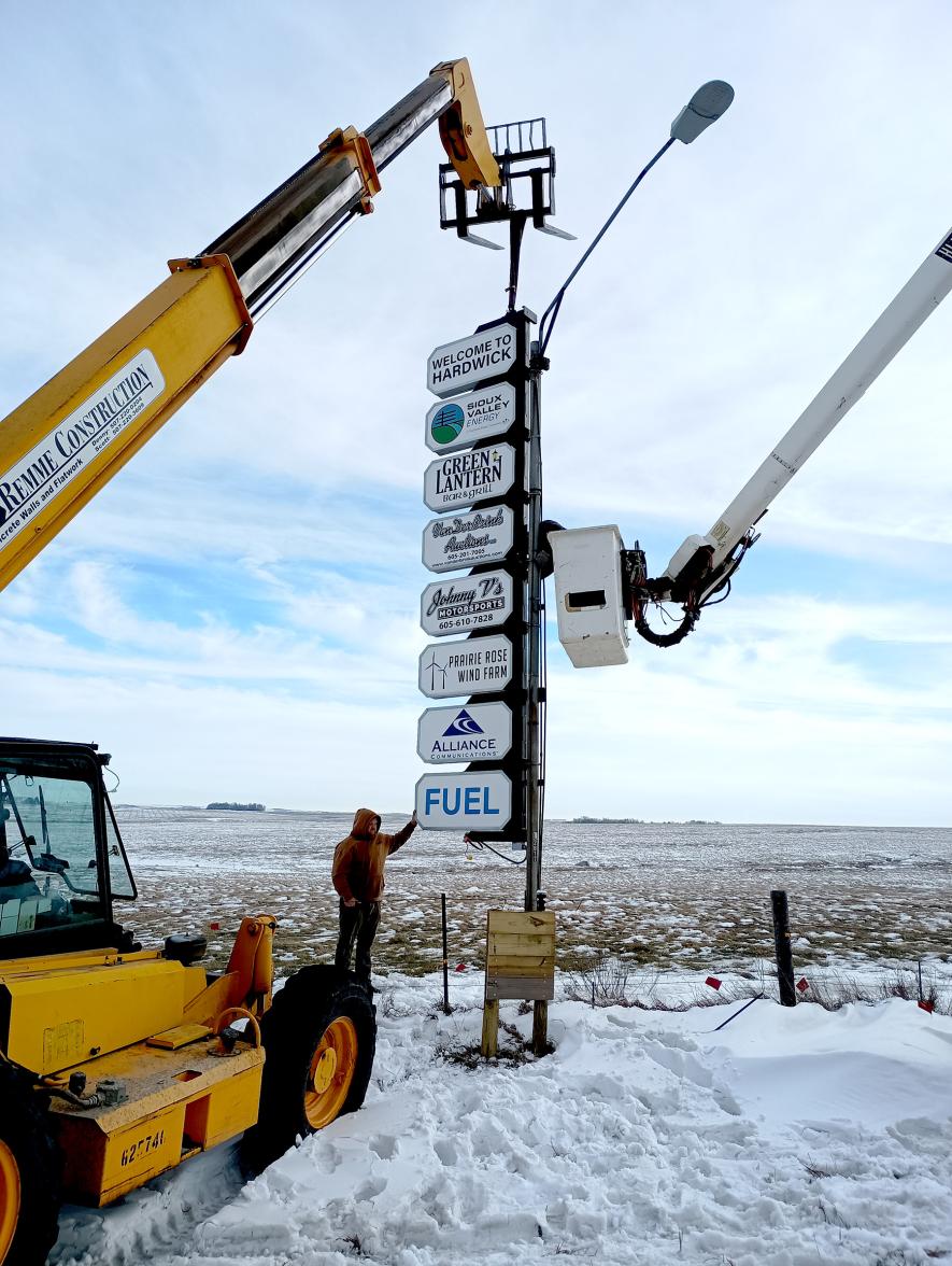 Remme Construction puts up new signs at the corner of Highway 75 and County Road 7 near Hardwick on Dec. 16