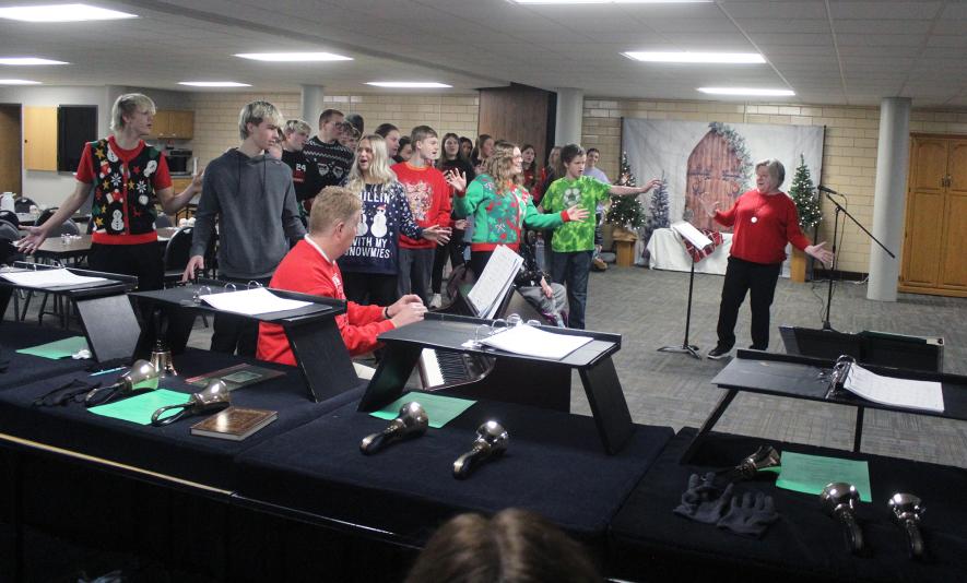 The LHS Cardinal Choir finishes singing “Snow Day” with a flourish under the direction of Seana Graber (far right) with piano accompanist Ryan Johnson. Mavis Fodness/Rock County Star Herald Photo