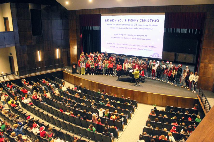 Closing the holiday celebration for elementary students is the Luverne High School concert choir singing “We Wish You a Merry Christmas.” Mavis Fodness/Rock County Star Herald Photo