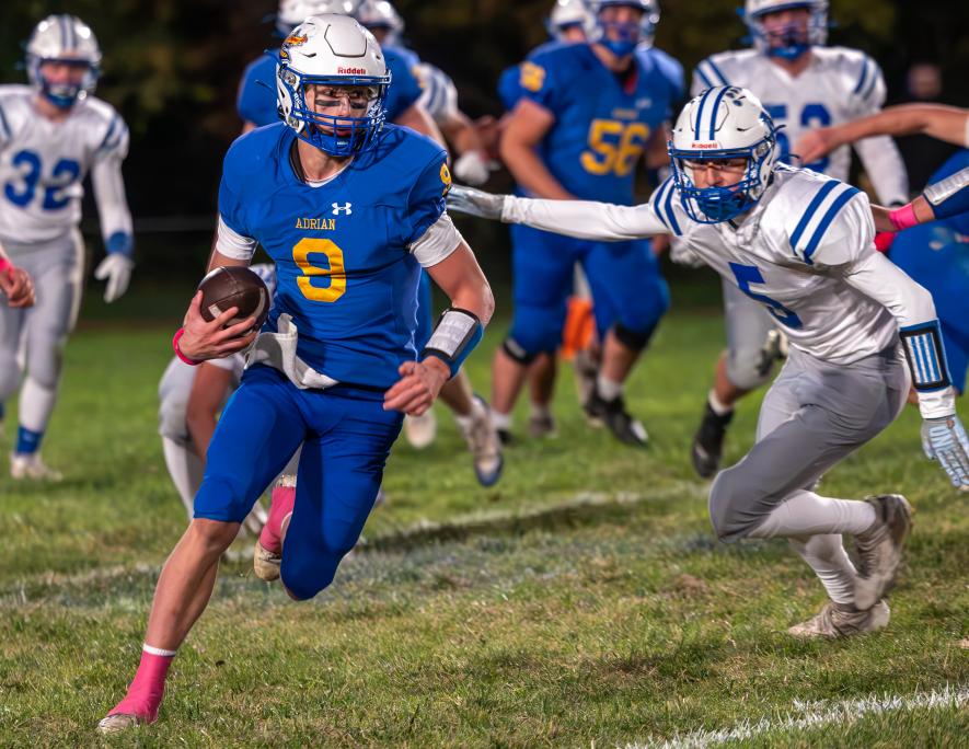 Rock County Star HerSkyler Jackson photo/AEFB1 A-E senior Charger Erlandson slips past several Nicollet players Oct. 14 at home. The Dragons beat the Raiders 60-6.ald Photo
