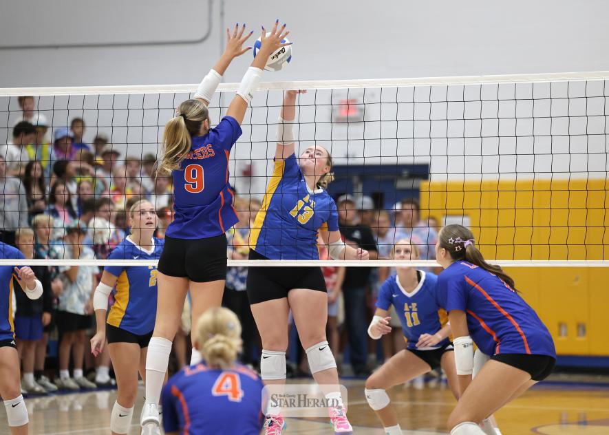 Greg Hoogeveen photo/0924A-EVB1 Dragon junior Taylor Luing sends the ball over the net against Candy Sept. 21 at home. A-E took down the Lancers 3-0.