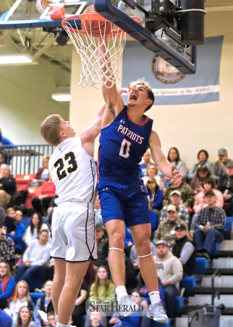H-BC junior Micah Bush goes airborne to dunk the ball against Southwest Christian in the first half of the game. Bush finished the game with 17 points as the Patriots beat the Eagles 80-76.