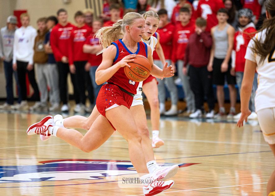 Samantha McGaffee photo/HBCGBB1 Patriot junior Brynn Bakken advances the ball down the court against Southwest Minnesota Christian at home Tuesday, Dec. 2. Bakken scored 10 points in the Patriots’ 66-33 win.