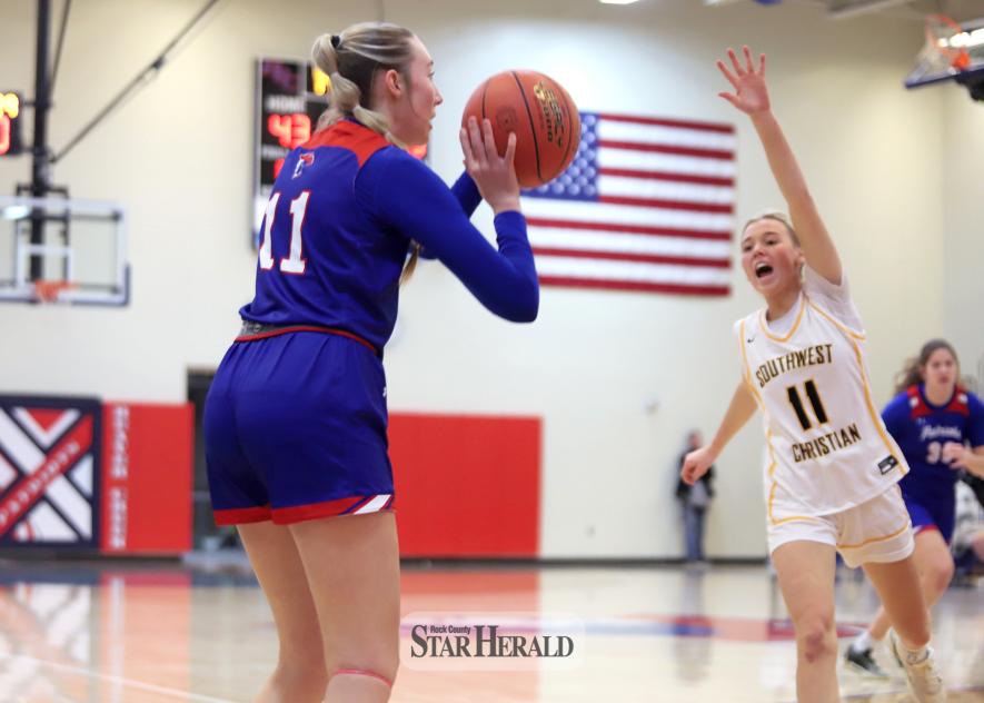 H-BC junior Ella Sammons lines up a three-point shot against Southwest Minnesota Christian Tuesday, Jan. 21. The Patriots beat the Eagles 62-59 at home.