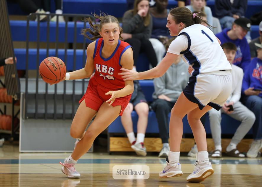 Greg Hoogeveen photo/HBCGBB3 H-BC junior Ava Steinhoff drives the ball under the hoop against RTR Friday, Feb. 6, in Hills. Steinhoff collected four points in the 54-41 win against the Knights.