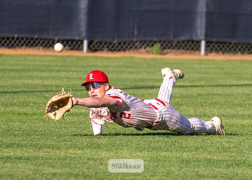 Luverne Junior Legion Red center fielder Ty Kopp dives for a ball during his team’s loss to Marshall Orange at Redbird Field June 11. Junior Legion Red won one game before losing four in a busy week of baseball action. (Greg Hoogeveen photo/0618 junior legion)