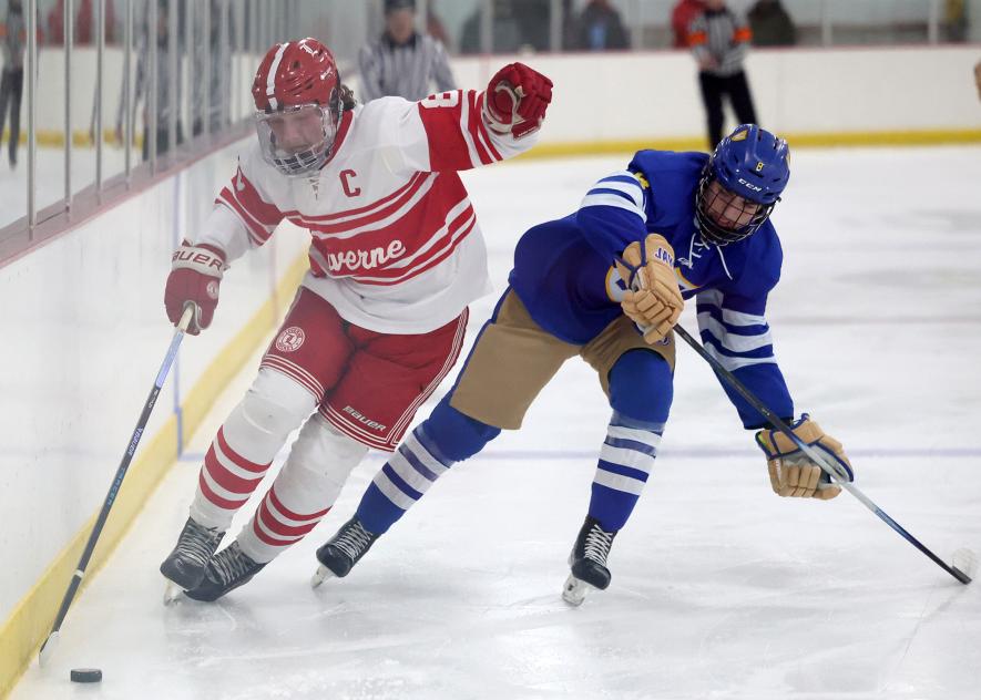 Greg Hoogeveen photo/LHS BHOC1W LHS senior Landyn Lais avoids a collision with a Waseca player along the boards as he directs the puck to the opposing goal. Luverne took down Waseca 4-2 Saturday, Dec. 13, at home.