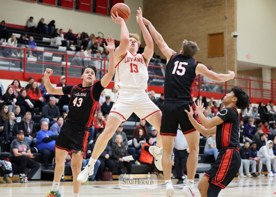 Greg Hoogeveen photo/LHSBBB2 Luverne senior Jaydon Johnson sends off a shot against Worthington Friday, Jan. 2, on the road. The Cardinals beat the Trojans 79-67 in a back-and-forth game.