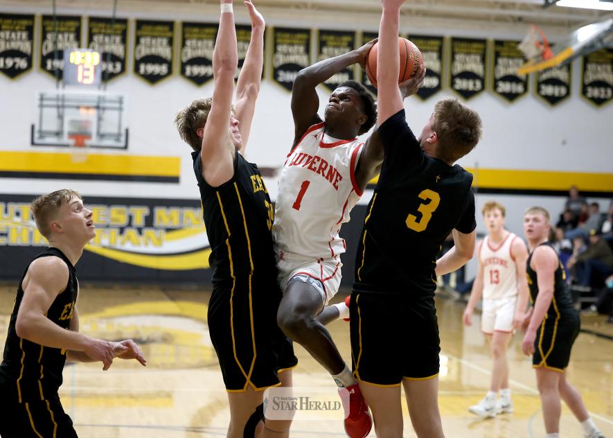 Greg Hoogeveen photo/LHSBBB1 LHS junior Darius Dolo drives the basket between two SWMC player Monday. Feb. 9, on the road. LHS fell 60-48 to the Eagles.