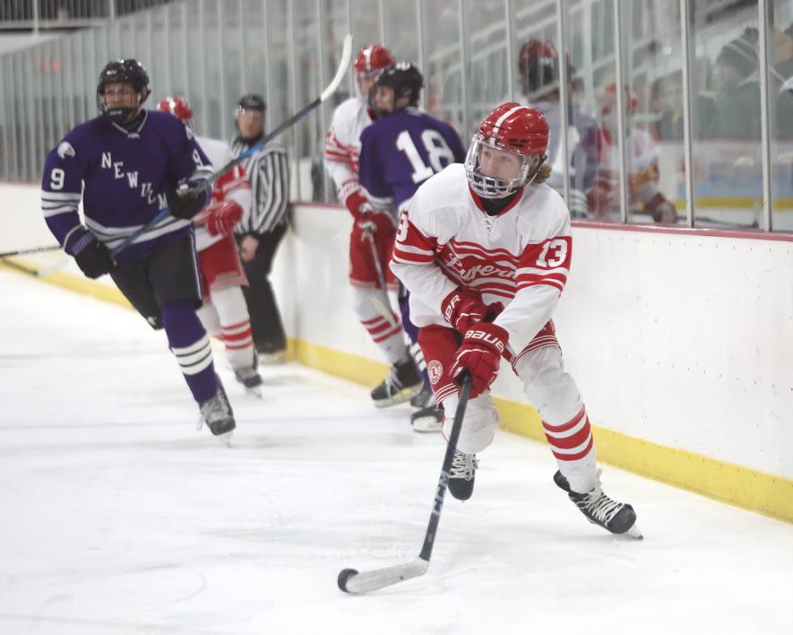 Senior Blaik Bork works the puck to the net against New Ulm Friday, Feb. 7. LHS beat the Eagles 6-2 at home. Greg Hoogeveen/Rock County Star Herald Photo