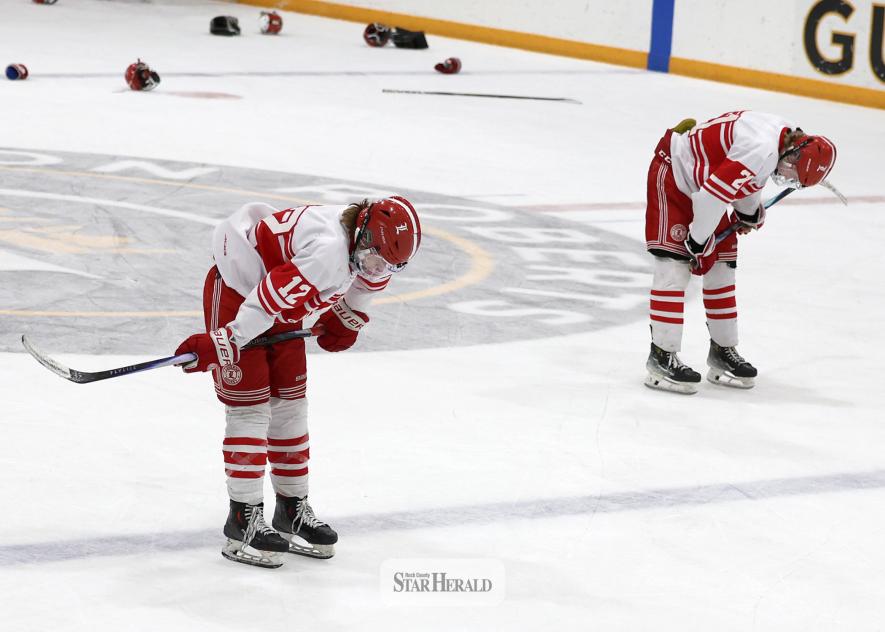 Greg Hoogeveen photo/LHSBHOC9 Luverne sophomore Mallachi Domagala, No. 12, and junior Colton Haubrich, No. 7, react to losing a 2-1 game to Mankato West after three overtime periods of play in St. Peter Feb. 26. Both teams played hard for over 80 minutes on the ice before Mankato scored the winning goal.
