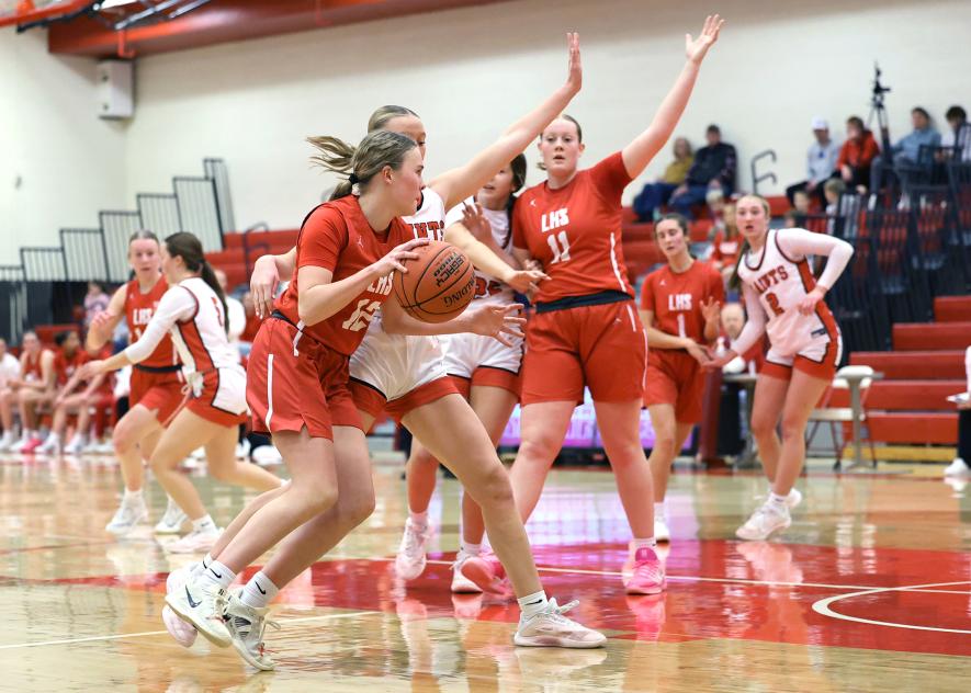 Greg Hoogeveen photo/LHSGBB1 LHS junior Hannah Cowell drives past a St. James player on her way to the hoop Friday, Jan. 9, in Luverne. Luverne fell 78-53 in the game.