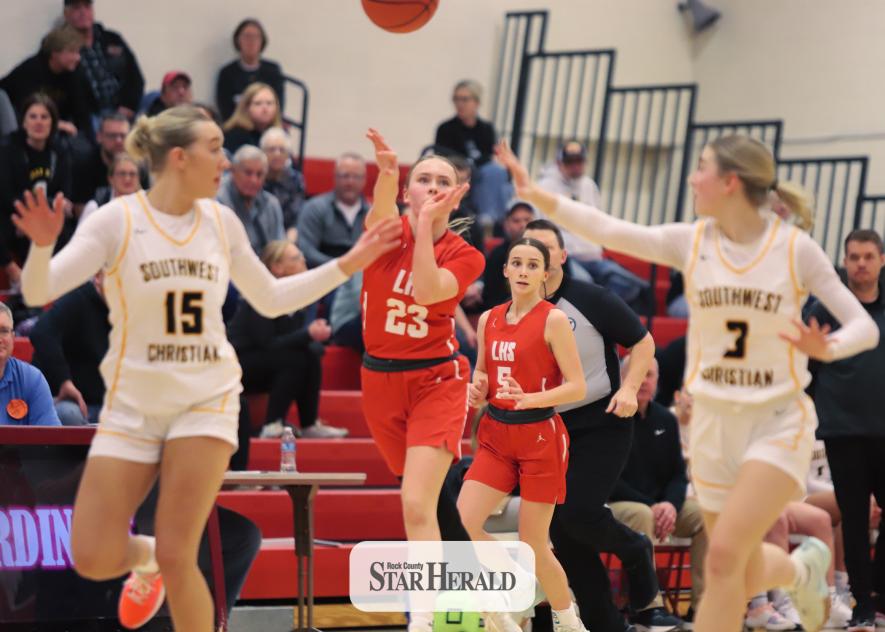Luverne sophomore Hannah Cowell throws up a pass between two Eagles players as the Cardinals break toward the net. Southwest Minnesota Christian beat Luverne 68-56 in Luverne Tuesday, Jan. 28.