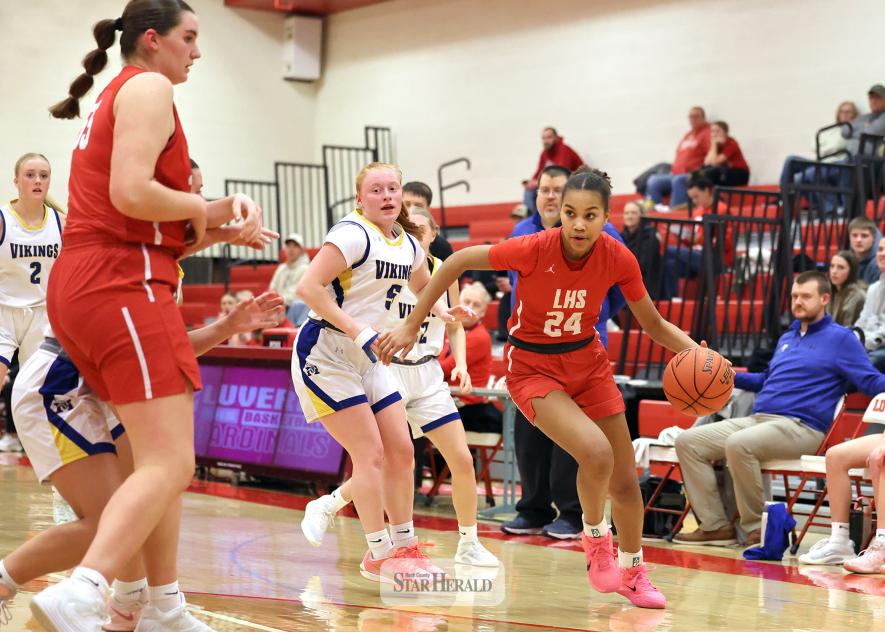 Greg Hoogeveen photo/LHSGBB2 Cardinal freshman Briella John drives to the hoop against Minneota at home Thursday, Jan. 22. John completed a double-double in the game collecting 16 points and 12 rebounds in a 68-59 loss to the Vikings.